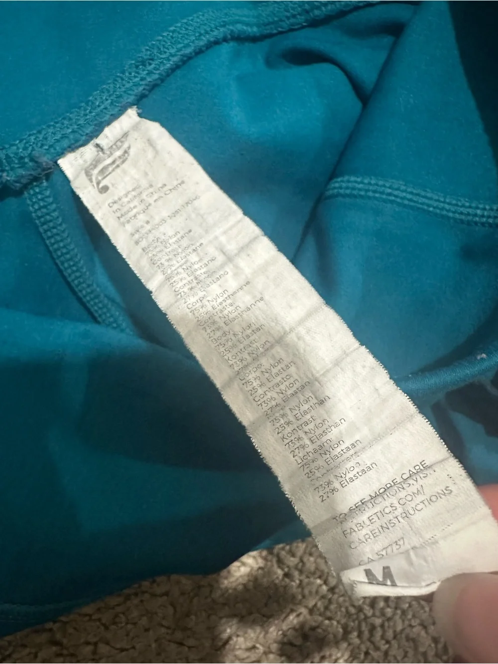 Fabletics Trinity Mid Rise Pocket Biker Shorts in Azure/Green Mist $59.95